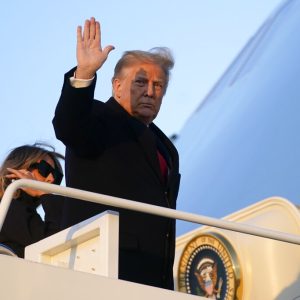 President Donald Trump waves as he boards Air Force One at Andrews Air Force Base, Md., Wednesday, Dec. 23, 2020. Trump is traveling to his Mar-a-Lago resort in Palm Beach, Fla. (AP Photo/Patrick Semansky)