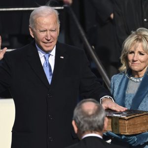 Joe Biden is sworn in as the 46th president of the United States by Chief Justice John Roberts as Jill Biden holds the Bible during the 59th Presidential Inauguration at the U.S. Capitol in Washington, Wednesday, Jan. 20, 2021.(Saul Loeb/Pool Photo via AP)