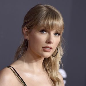 FILE - This Nov. 24, 2019 file photo shows Taylor Swift at the American Music Awards in Los Angeles. Swift announced online that she’s dropping the first of her re-recorded albums. She said “Fearless: Taylor’s Version” features re-recorded songs from her sophomore album, “Fearless.” The new set will also contain six never-before released songs. Swift will also release a new version of her song “Love Story” from “Fearless” on Thursday at midnight. (Photo by Jordan Strauss/Invision/AP, File)