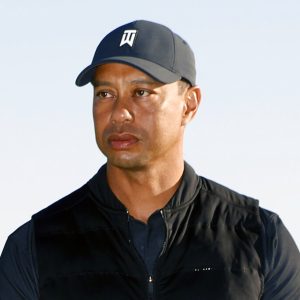 FILE - Tiger Woods looks on during the trophy ceremony on the practice green after the final round of the Genesis Invitational golf tournament at Riviera Country Club, Sunday, Feb. 21, 2021, in the Pacific Palisades area of Los Angeles. Woods was injured Tuesday, Feb. 23, 2021, in a vehicle rollover in Los Angeles County and had to be extricated from the vehicle with the “jaws of life” tools, the Los Angeles County Sheriff’s Department said.(AP Photo/Ryan Kang)