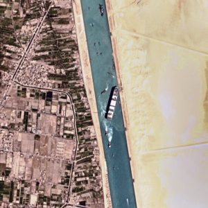 This satellite photo from Planet Labs Inc. shows the Ever Given cargo ship stuck in Egypt's Suez Canal Monday, March 29, 2021. Engineers on Monday "partially refloated" the colossal container ship that continues to block traffic through the Suez Canal, authorities said, without providing further details about when the vessel would be set free. (Planet Labs Inc. via AP)