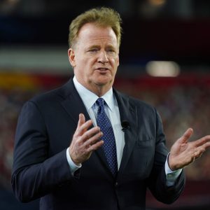 FILE - Commissioner Roger Goodell gestures during the NFL Honors ceremony as part of Super Bowl 55 in Tampa, Fla., in this Friday, Feb. 5, 2021, file photo. The NFL is increasing the regular season to 17 games, as expected, and reducing the preseason to three games. Team owners on Tuesday, March 30, 2021, approved the 17th game, marking the first time in 43 years the regular season has been increased.(AP Photo/Charlie Riedel, File)