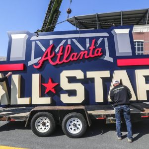 Workers load an All-Star sign onto a trailer after it was removed from Truist Park in Atlanta, Tuesday, April 6, 2021. Major League Baseball plans to relocate the All-Star Game to Coors Field in Denver after pulling this year's Midsummer Classic from Atlanta over objections to sweeping changes to Georgia's voting laws, according to a person familiar with the decision.
The person spoke to The Associated Press on condition of anonymity Monday night, April 5, 2021, because MLB hadn’t announced the move yet. (John Spink/Atlanta Journal-Constitution via AP)