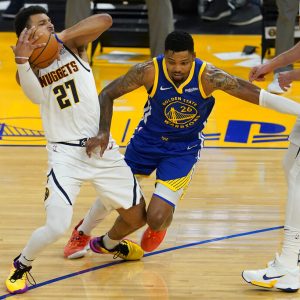 Denver Nuggets guard Jamal Murray (27) is fouled by Golden State Warriors forward Kent Bazemore (26) during the first half of an NBA basketball game in San Francisco, Monday, April 12, 2021. (AP Photo/Jeff Chiu)