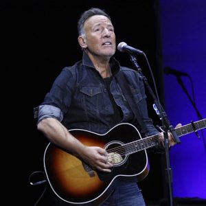 FILE - Bruce Springsteen performs at the 13th annual Stand Up For Heroes benefit concert in support of the Bob Woodruff Foundation in New York on Nov. 4, 2019. Springsteen is this year's winner of the Woody Guthrie Prize. The award honors artists of any medium who continue the legacy of the Oklahoma songwriter. Springsteen calls Guthrie one of his most important influences. The legendary performer will be honored in a virtual ceremony May 13.  (Photo by Greg Allen/Invision/AP, File)
