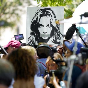 A portrait of Britney Spears looms over supporters and media members outside a court hearing concerning the pop singer's conservatorship at the Stanley Mosk Courthouse, Wednesday, June 23, 2021, in Los Angeles. (AP Photo/Chris Pizzello)