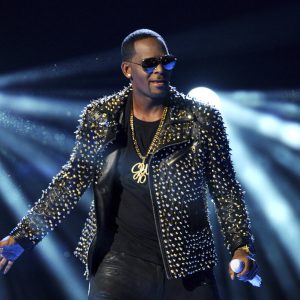 FILE - R. Kelly performs at the BET Awards on June 30, 2013, in Los Angeles. R. Kelly’s new lawyers are asking a judge to postpone his Aug. 9, 2021, sex trafficking trial in New York City, arguing they haven’t had enough time to prepare because he’s under a mandatory jail quarantine. (Photo by Frank Micelotta/Invision/AP, File)
