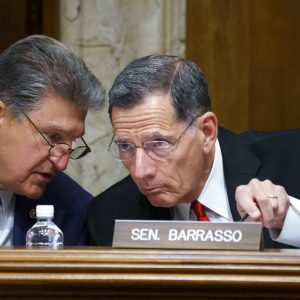 FILE - In this June 23, 2021, file photo, Sen. Joe Manchin, D-W.Va., chair of the Senate Energy and Natural Resources Committee holds a hearing with Ranking Member Sen. John Barrasso, R-Wyo., right, at the Capitol in Washington. A former federal law enforcement officer is alleging that President Joe Biden's pick to oversee federal lands in western states stonewalled a 1989 investigation into the sabotage of an Idaho timber sale. The allegation against U.S. Bureau of Land Management nominee Tracy Stone-Manning was made in a letter from a retired investigator released Thursday, July 15, 2021, by Sen. Barrasso. (AP Photo/J. Scott Applewhite, File)