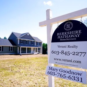 FILE - In this Thursday, June 24, 2021 file photo, a real estate sign is posted in front of a newly constructed single family home in Auburn, N.H. U.S. home prices registered the fastest growth in 17 years in May as a surge in demand for housing outstripped the supply. The S&P CoreLogic Case-Shiller 20-city home price index, released Tuesday, July 27 soared 17% in May from a year earlier on top of a 15% jump in April.  (AP Photo/Charles Krupa, File)
