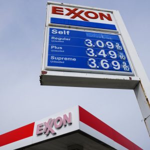 This April 28, 2021 photo shows an Exxon service station sign in Philadelphia.  Exxon Mobil reported profits of $4.69 billion in the second quarter, Friday, July 30, when demand for fuel recovered from lows reached earlier in the pandemic. The oil giant brought in $67.74 billion in revenue, more than double the amount at the same time last year.   (AP Photo/Matt Rourke)