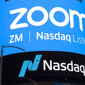 FILE - This April 18, 2019, file photo shows a sign for Zoom Video Communications ahead of their Nasdaq IPO in New York. Zoom has agreed to pay $85 million, Monday, Aug. 2, 2021,  to settle a lawsuit alleging allegations its videoconferencing service’s weak privacy controls opened too many peepholes into its users’ personal information and made it too easy to disrupt their meetings during the early stages of the pandemic.   (AP Photo/Mark Lennihan, File)