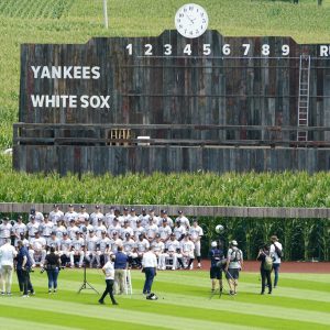 New York Yankees players and coaches pose for a team photo before a baseball game against the Chicago White Sox, Thursday, Aug. 12, 2021, in Dyersville, Iowa. The Yankees and White Sox are playing at a temporary stadium in the middle of a cornfield at the Field of Dreams movie site, the first Major League Baseball game held in Iowa. (AP Photo/Charlie Neibergall)