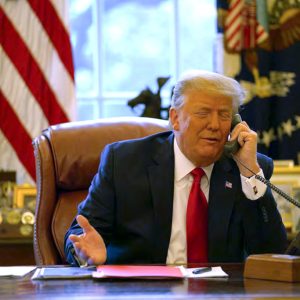 In this image released in the final report by the House select committee investigating the Jan. 6 attack on the U.S. Capitol, President Donald Trump talks on the phone to Vice President Mike Pence from the Oval Office of the White House on Jan. 6, 2021. (House Select Committee via AP)