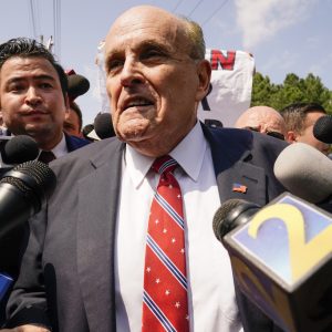 Rudy Giuliani speaks outside the Fulton County jail, Wednesday, Aug. 23, 2023, in Atlanta. Giuliani has surrendered to authorities in Georgia to face an indictment alleging he acted as former President Donald Trump’s chief co-conspirator in a plot to subvert the 2020 election. (AP Photo/Brynn Anderson)
