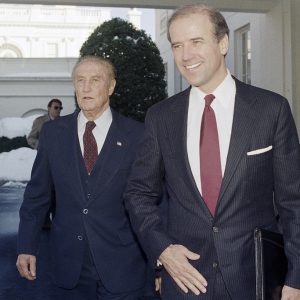 FILE - Chairman of the Senate Judiciary Committee, Joe Biden (D-Del.), right, and the former chairman of the panel, Sen. Strom Thurmond (R-S.C.), depart the West Wing of White House in Washington, Nov. 12, 1987, after meeting with President Reagan. On Sept. 1, 2023, The Associated Press reported on President Biden’s inaccurate claim that he “literally” convinced Thurmond, a segregationist, to vote in favor of the Civil Rights Act. (AP Photo/Ira Schwarz, File)