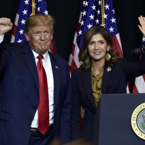 FILE - President Donald Trump appears with Gov. Kristi Noem in Sioux Falls, S.D., Sept. 7, 2018. As his rivals spend the day holding town halls and meet-and-greets in early-voting states, Donald Trump is heading to South Dakota on Friday, Sept. 8, 2023, for a party fundraiser that will double as an opportunity for the state's governor, Kristi Noem, to showcase herself as a potential vice presidential pick. (AP Photo/Susan Walsh, File)