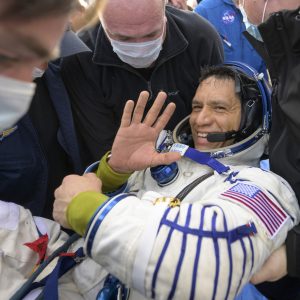 NASA astronaut Frank Rubio is helped out of the Soyuz MS-23 spacecraft just minutes after he and Russian cosmonauts Sergey Prokopyev and Dmitri Petelin, landed in a remote area near the town of Zhezkazgan, Kazakhstan on Wednesday, Sept. 27, 2023.  The extended mission means that Rubio now holds the record for longest spaceflight by an American. (Bill Ingalls/NASA via AP)
