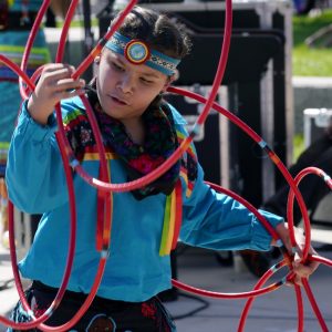 A performer from the Native American Hoop Dance of Ballet Arizona dances at an Indigenous Peoples Day festival Monday, Oct. 9, 2023, in Phoenix. (AP Photo/Ross D. Franklin)