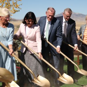 With Heart Mountain as a backdrop, Elder Steven R. Bangerter of the North America Central Area Presidency (center), his wife Susan (center left), and Elder Kevin R. Duncan, Exec. Dir. of the Temple Dept. (center right) of The Church of Jesus Christ of Latter-day Saints, and his wife Nancy (to his right), break ground with local participants at the Cody Wyoming Temple groundbreaking ceremony on Friday, September 27, 2024. (Photo courtesy of the Church of Jesus Christ of Latter-Day Saints).