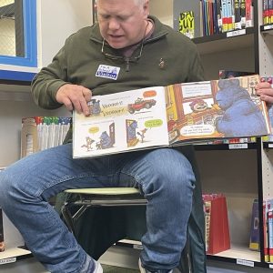Mac Watson reads to students