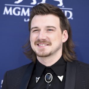 FILE - In this April 7, 2019, file photo, Morgan Wallen arrives at the 54th annual Academy of Country Music Awards in Las Vegas. In a social media post late Wednesday, Feb. 10, 2021, Wallen told his fans not to downplay the racist language he was caught saying on camera. (Photo by Jordan Strauss/Invision/AP, File)