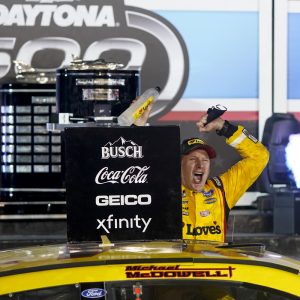 Michael McDowell celebrates after winning the NASCAR Daytona 500 auto race at Daytona International Speedway, Monday, Feb. 15, 2021, in Daytona Beach, Fla. (AP Photo/John Raoux)