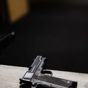 Gun on wooden table